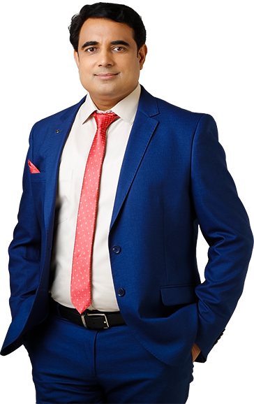 Pt. Pawan Kaushik the celebrity astrologer of India wearing a blue coat and pants with a white shirt and red stripped tie
